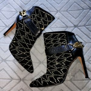 Black leather ankle boots with studs and rhinestone design
